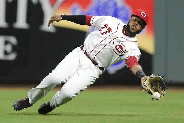 Cincinnati Reds right fielder Phillip Ervin (27) is unable to reach a fly ball in the seventh inning against the St. Louis Cardinals at Great American Ball Park in Cincinnati.   (Kareem Elgazzar / The Cincinnati Enquirer)